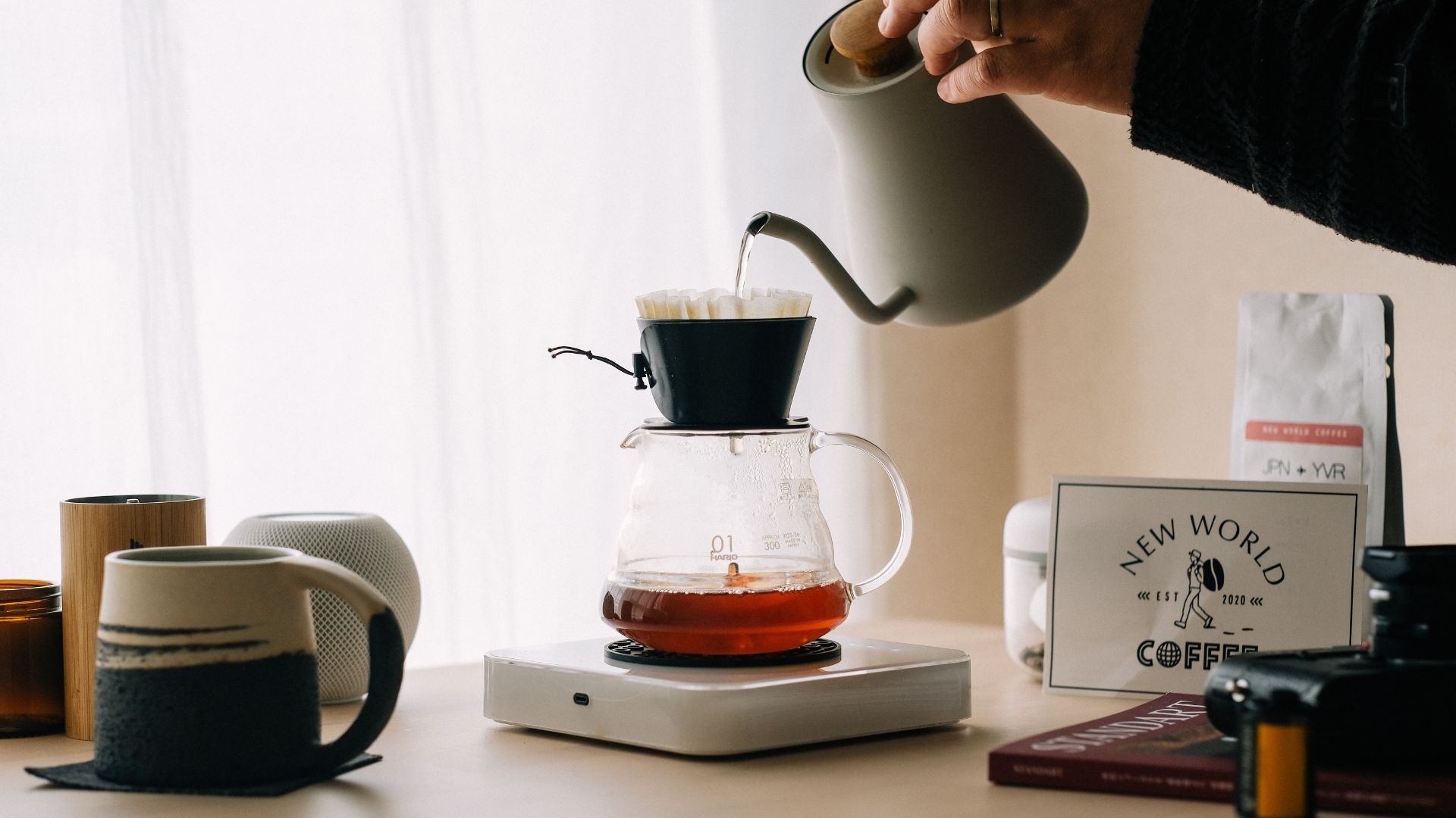 Woman brewing coffee