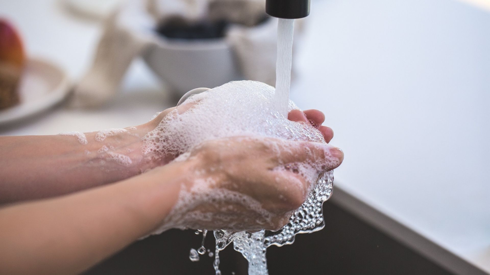 A person washing his hands.