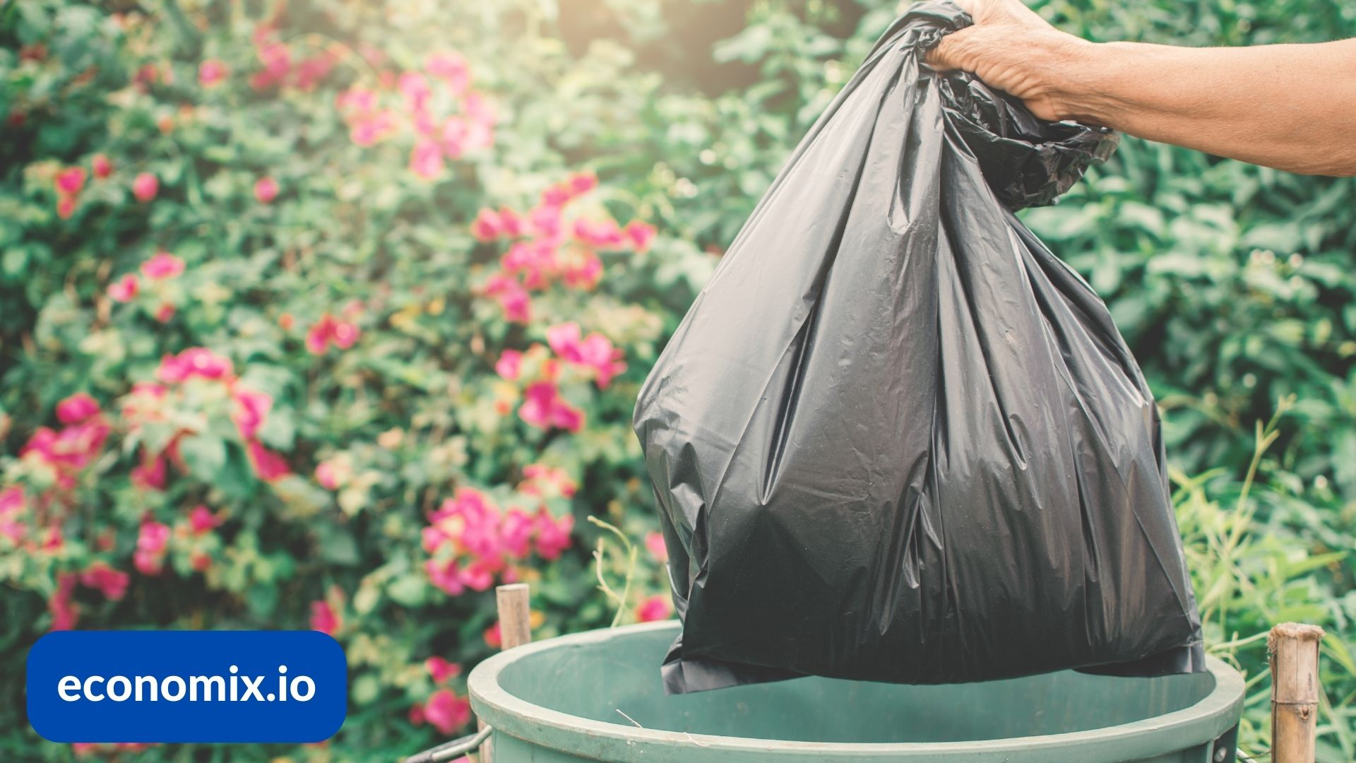 A pet owner using a biodegradable waste bag for pet cleanup