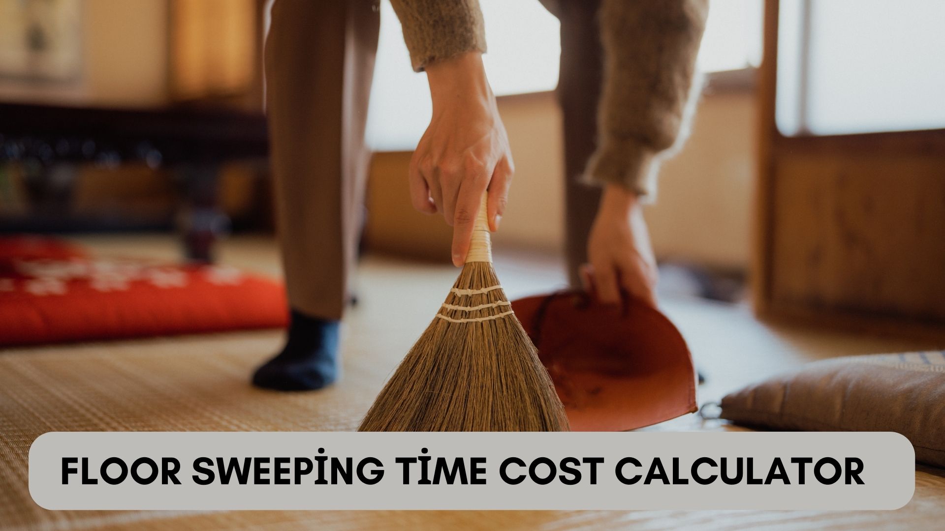 Person sweeping a tiled floor with a broom