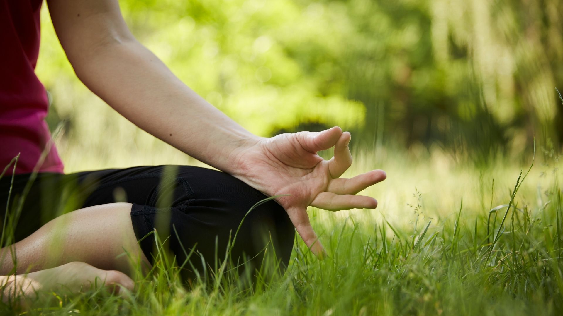 A woman doing yoga on the mountain