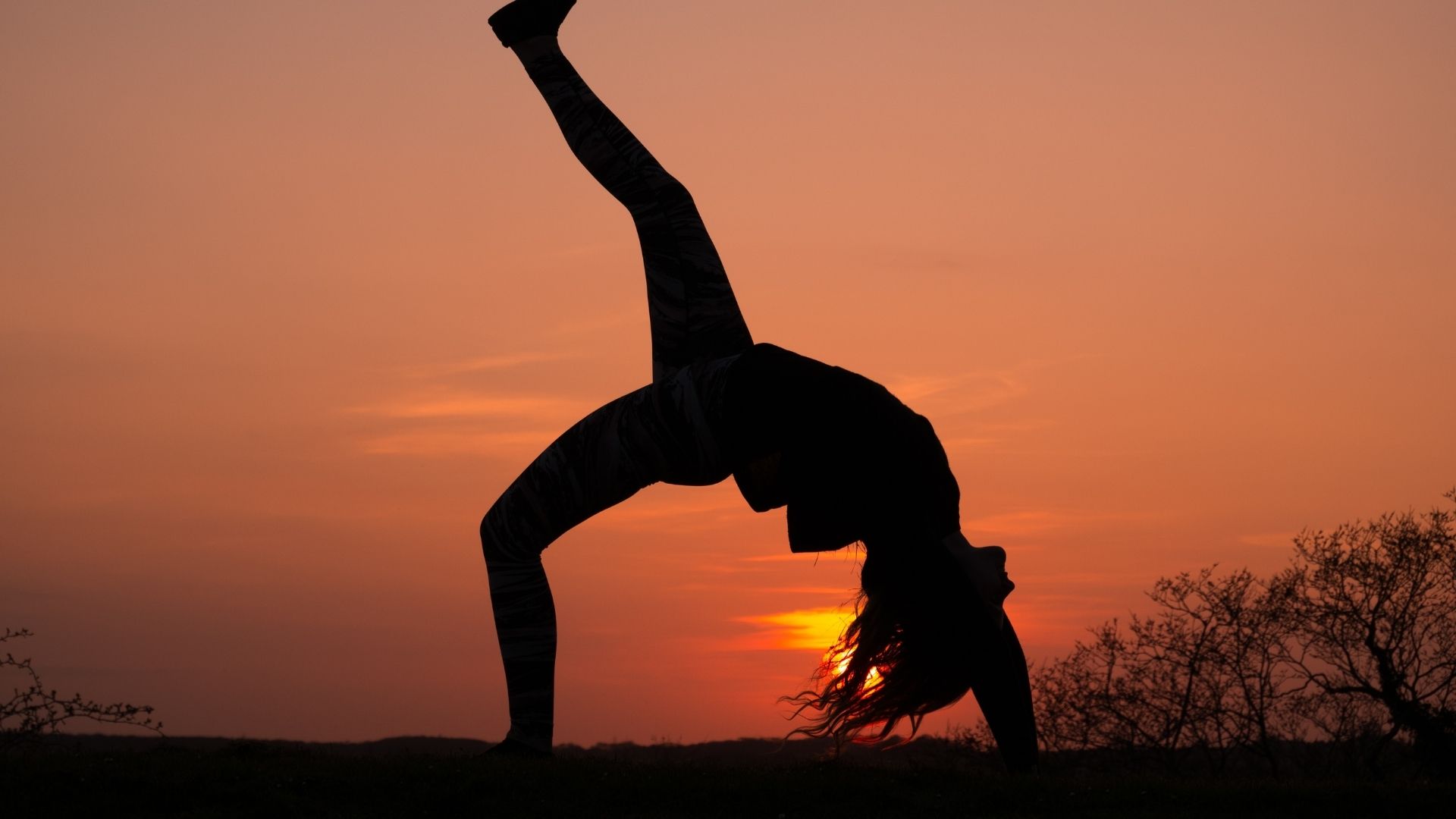 An individual engaged in aerobics, using a time cost calculator to plan their fitness routine