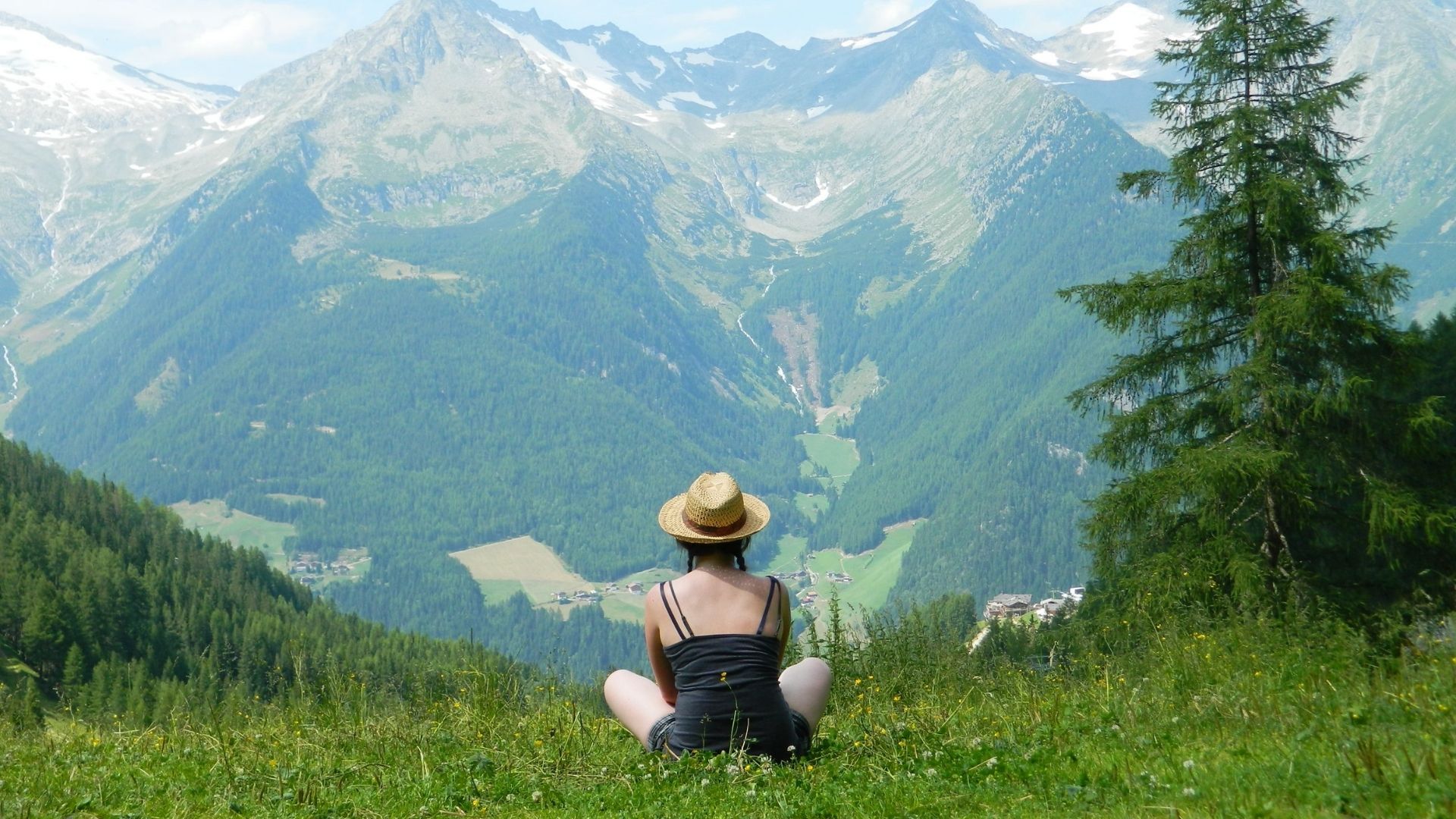 A mountaineer climbing a steep rock face, using the Mountaineering Time Cost Calculator to manage their schedule